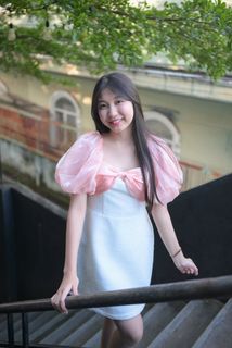 Radiant smile of a young, elegant Vietnamese girl in a pink and white dress.-6
