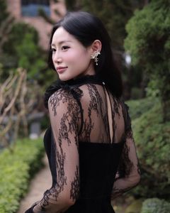 XVG No.3: Elegant Girl in Black Dress Amidst Ancient Garden Charm-5