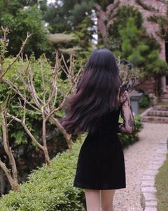XVG No.3: Elegant Girl in Black Dress Amidst Ancient Garden Charm-3