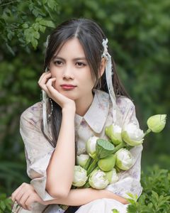 Elegant Vietnamese Woman with Pure Lotus Flowers-2