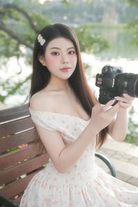 Graceful Woman in White Floral Dress Amidst Serene Summer Nature-0