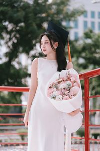 Beautiful Female Graduate Embraces Success at Graduation Ceremony-7