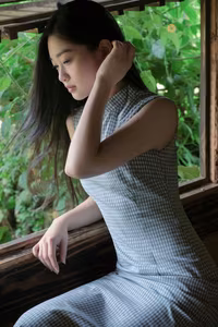 XVG No.43: Discover the captivating elegance of an Asian young woman in a pensive moment by the window.-1