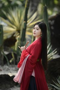 Traditional Vietnamese Beauty: Young woman with ancient instrument, immersed in culture and music.-10