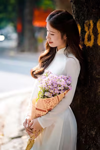XVG No.55: Vietnamese Ao Dai Charm A Radiant Smile Embracing Youth and Tradition Under Golden Sun-3