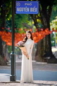 XVG No.55: Vietnamese Ao Dai Charm A Radiant Smile Embracing Youth and Tradition Under Golden Sun-7