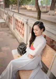 Graceful Vietnamese Girl in White Ao Dai, Radiant Smile at Ancient Site 1000026917-8