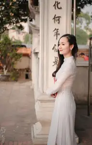 Graceful Vietnamese Girl in White Ao Dai, Radiant Smile at Ancient Site 1000026917-11