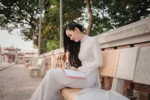 Graceful Vietnamese Girl in White Ao Dai, Radiant Smile at Ancient Site 1000026917-7