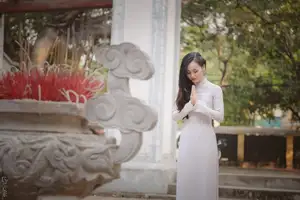 Graceful Vietnamese Girl in White Ao Dai, Radiant Smile at Ancient Site 1000026917-19