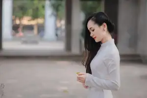 Graceful Vietnamese Girl in White Ao Dai, Radiant Smile at Ancient Site 1000026917-16