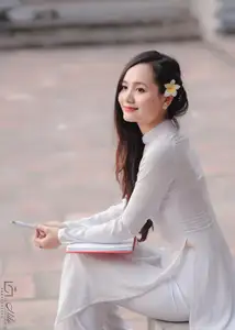 Graceful Vietnamese Girl in White Ao Dai, Radiant Smile at Ancient Site 1000026917-1