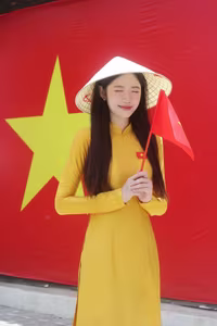 VGU No.114: Radiant Yellow Ao Dai Amidst Lotus Blooms, Embodying Vietnamese Grace-6