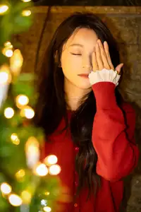 Radiant Smile Girl in Red Amidst Twinkling Lights: Warm Beauty for Festive Season-3