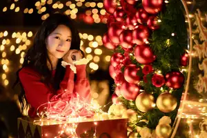 Radiant Smile Girl in Red Amidst Twinkling Lights: Warm Beauty for Festive Season-18