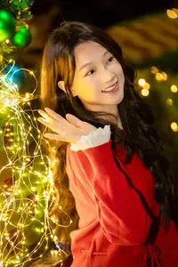 Radiant Smile Girl in Red Amidst Twinkling Lights: Warm Beauty for Festive Season-7