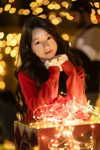 Radiant Smile Girl in Red Amidst Twinkling Lights: Warm Beauty for Festive Season-12