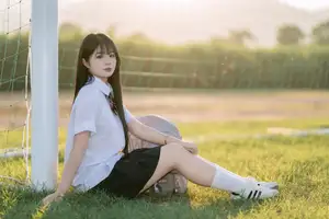Youthful Schoolgirl in Uniform: Serene Golden Hour Beauty, a Glimpse into Nostalgic Student Life.-5