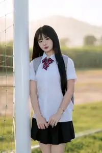 Youthful Schoolgirl in Uniform: Serene Golden Hour Beauty, a Glimpse into Nostalgic Student Life.-1