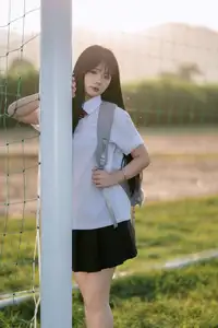 Youthful Schoolgirl in Uniform: Serene Golden Hour Beauty, a Glimpse into Nostalgic Student Life.-0