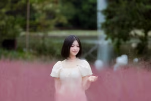 XVG No.33: Ethereal Beauty in White Dress Amidst Dreamy Pink Grass Field - A Serene Nature Escape-12