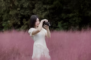 XVG No.33: Ethereal Beauty in White Dress Amidst Dreamy Pink Grass Field - A Serene Nature Escape-4