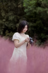 XVG No.33: Ethereal Beauty in White Dress Amidst Dreamy Pink Grass Field - A Serene Nature Escape-3