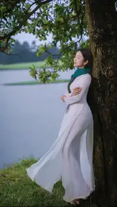 VGU No.172: Captivating Vietnamese Ao Dai Student in a Dreamy Moment, Showcasing Pure Grace Amidst Nature.-1