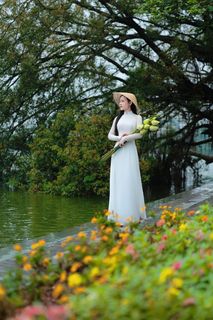 Vietnamese Ao Dai Beauty: Elegant Young Woman by Hoan Kiem Lake, Traditional Charm.-4