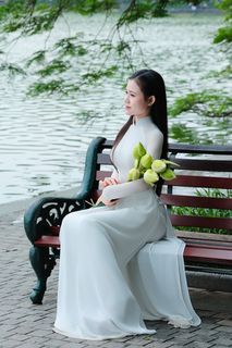 Vietnamese Ao Dai Beauty: Elegant Young Woman by Hoan Kiem Lake, Traditional Charm.-6