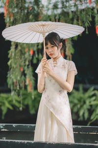 Elegant Ao Dai: Vietnamese Traditional Beauty in a Lush Garden-1