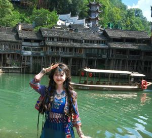 Discover Fenghuang Ancient Town: Serene boat ride, historic riverside charm.-0