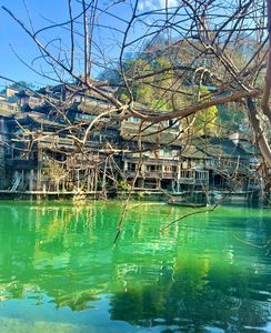 Discover Fenghuang Ancient Town: Serene boat ride, historic riverside charm.-4