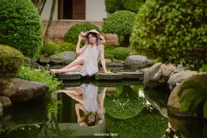 Graceful Young Woman in a Dreamy Garden: A Serene and Elegant Moment 1000025211-8