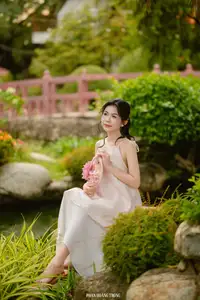 Graceful Young Woman in a Dreamy Garden: A Serene and Elegant Moment 1000025211-3