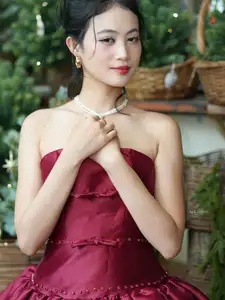 VGU No.187: Charming Woman in Red Dress Shines with Elegant Christmas Style. Discover Festive Fashion & Holiday Grace!-2