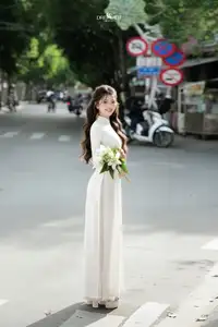 Vietnamese Schoolgirl Gracefully in Pure White Ao Dai Traditional Conical Hat and Lilies-2