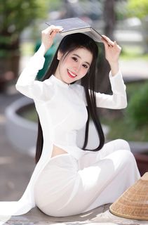 Vietnamese Beauty: Elegant Traditional White Ao Dai Woman with Conical Hat-12