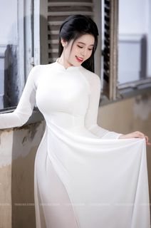 Vietnamese Beauty: Elegant Traditional White Ao Dai Woman with Conical Hat-6