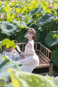 Discover Lu Xuan Xuan's Graceful Beauty in a White Dress Amidst a Serene Lotus Pond - XiuRen No.10630-48