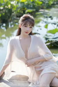 Discover Lu Xuan Xuan's Graceful Beauty in a White Dress Amidst a Serene Lotus Pond - XiuRen No.10630-46