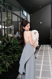 Elegant Woman and Adorable Pomeranian: Chic Fashion & Pet Joy.-2