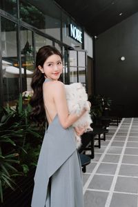 Elegant Woman and Adorable Pomeranian: Chic Fashion & Pet Joy.-0