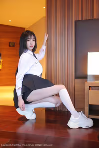 Irresistibly Alluring: Ruan Qing's Chic Uniform Style in XiuRen Photo Series No.10335-7