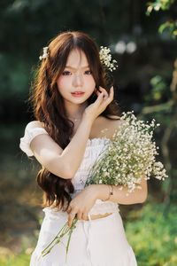 Captivating Portrait: Gentle Girl's Natural Beauty with Pure White Flowers in Golden Sunlight. Discover Her Grace.-3