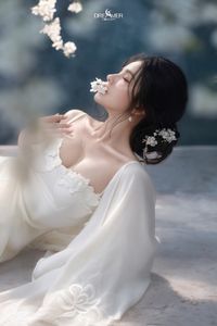 Discover Ethereal Grace: An Asian Beauty in Pure White Amidst Delicate White Blossoms-14