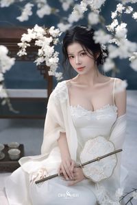 Discover Ethereal Grace: An Asian Beauty in Pure White Amidst Delicate White Blossoms-15