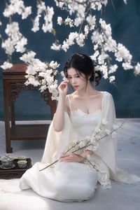 Discover Ethereal Grace: An Asian Beauty in Pure White Amidst Delicate White Blossoms-16