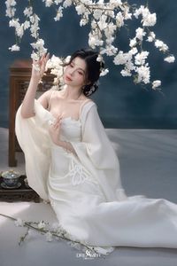 Discover Ethereal Grace: An Asian Beauty in Pure White Amidst Delicate White Blossoms-10