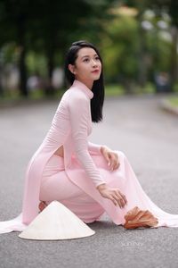 Pink Ao Dai Grace: Vietnamese Beauty with Elegant Girl and Traditional Conical Hat-2